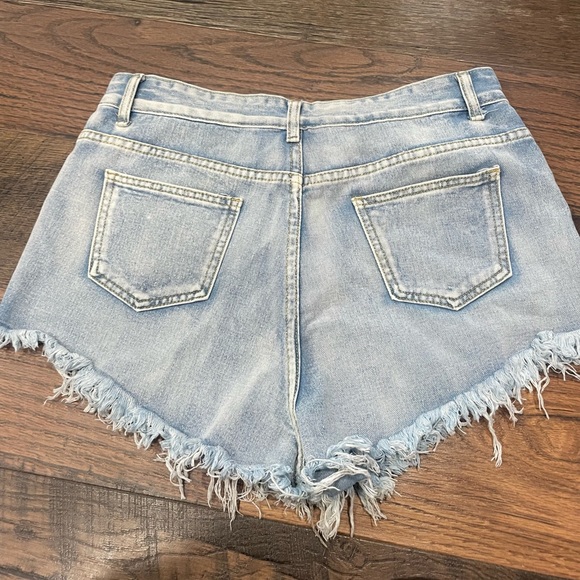 Really cute unworn light jean shorts, size large, SHEIN. - Picture 2 of 3